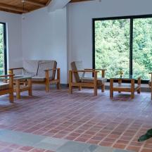 a room with chairs and tables and windows