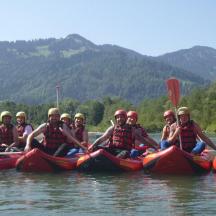 a group of people riding on kayaks on a river