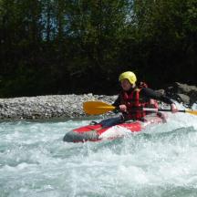 a person in a raft in a river