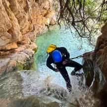 a man is in the water in a river