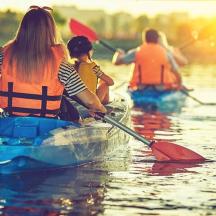 a group of people kayaking on a body of water