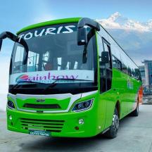 a green bus parked in a parking lot
