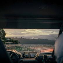 a view from the inside of a car looking at a mountain