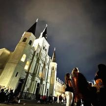 a group of people standing in front of a church
