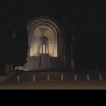a white building with a tower at night