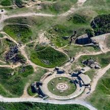 an aerial view of a building in a park