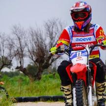 a person riding a dirt bike on the road