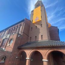 a tall brick building with a clock tower on it