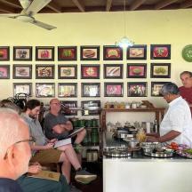 a group of people sitting at a bar in a restaurant