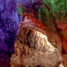 a painting of a cave with colorful walls
