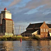 a building and a building with a tower on the water