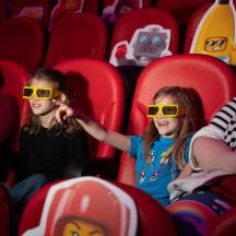 a group of people wearing glasses in an auditorium