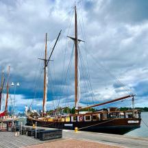 a large boat is docked at a dock