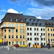a building with a statue in the middle of a street