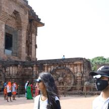 a man and a woman standing in front of a building