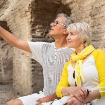 a man and a woman taking a picture with a cell phone