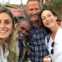 a group of three people posing for a picture