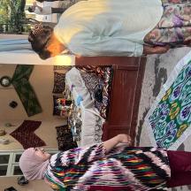 a woman laying on a bed in a room