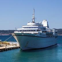 a cruise ship docked at a dock in the water