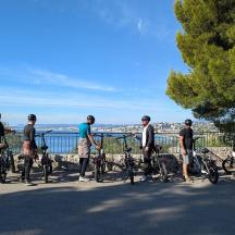 a group of people standing with their bikes