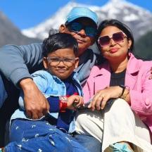 a man and a woman sitting next to a child