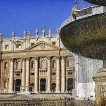 a large building with a fountain in front of it