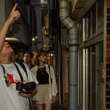 a man taking a picture of a woman with a camera