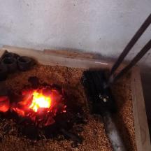 a fire pit with a fire in the ground