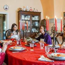 a group of people sitting around a table eating