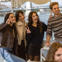 a group of people standing on a boat