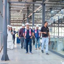 a group of people walking down a walkway