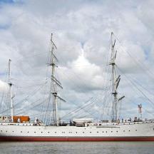 a large white ship sitting in the water