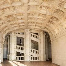 a large white building with an ornate ceiling