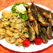 a plate of food with potatoes and vegetables on a table