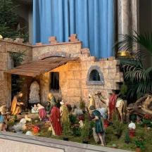 a model of a church with people standing around it
