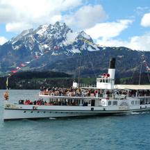 a group of people on a boat in the water