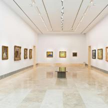 an art gallery with paintings on the walls