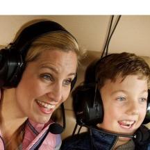 a woman and a boy with headphones on