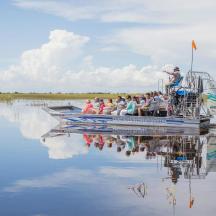 a group of people on a boat on the water