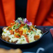 a bowl of food sitting on top of a table