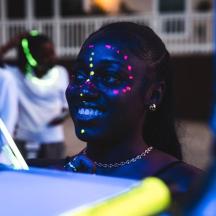 a young girl with face paint on