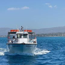a white boat in the water on the ocean