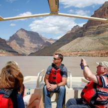a group of people on a boat on the river