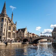 a bridge over a river in a city with buildings