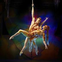 a couple of ballet dancers on a stage