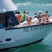 a group of people on a boat in the water