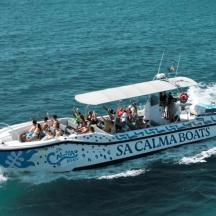 a group of people on a boat in the water