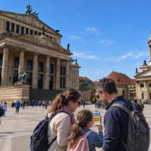 a group of people standing in front of a building
