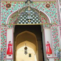 an entrance to a building with a patterned wall