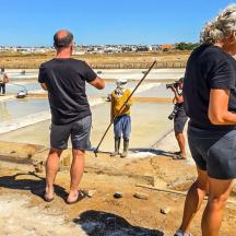 a group of people standing around a construction site